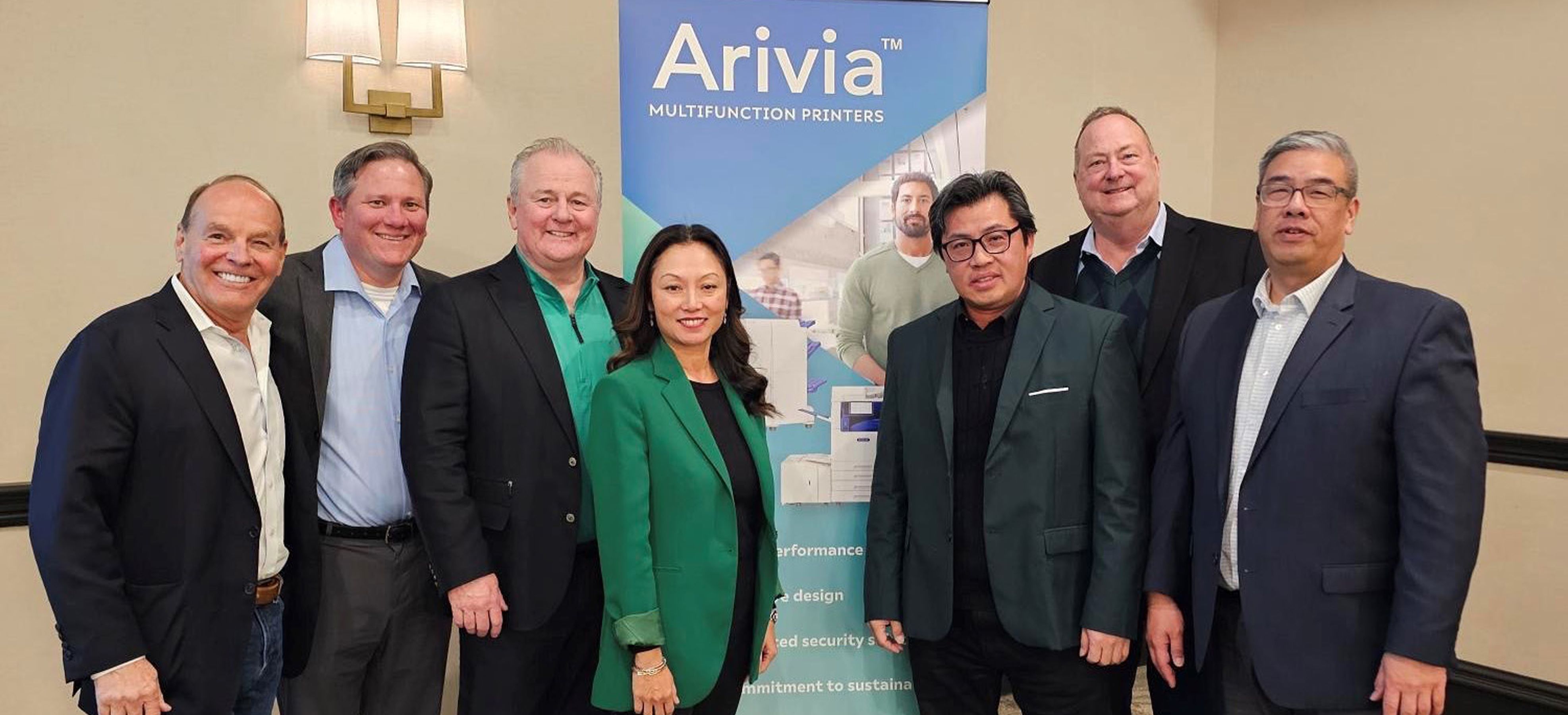 Katun Leadership at 2025 Executive Connections Summit with an Arivia Sign