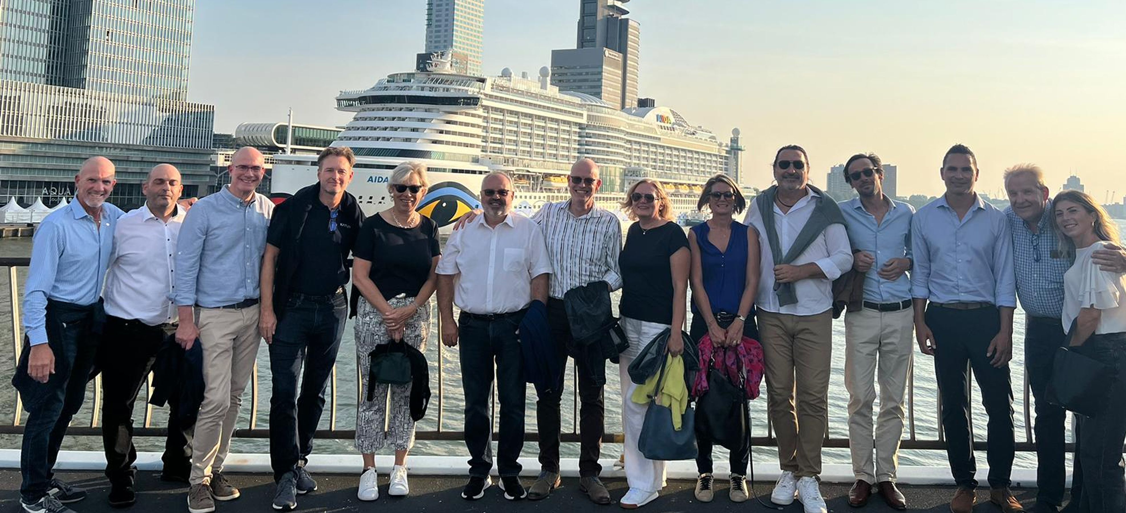 Katun Employees Celebrating in front of a yacht