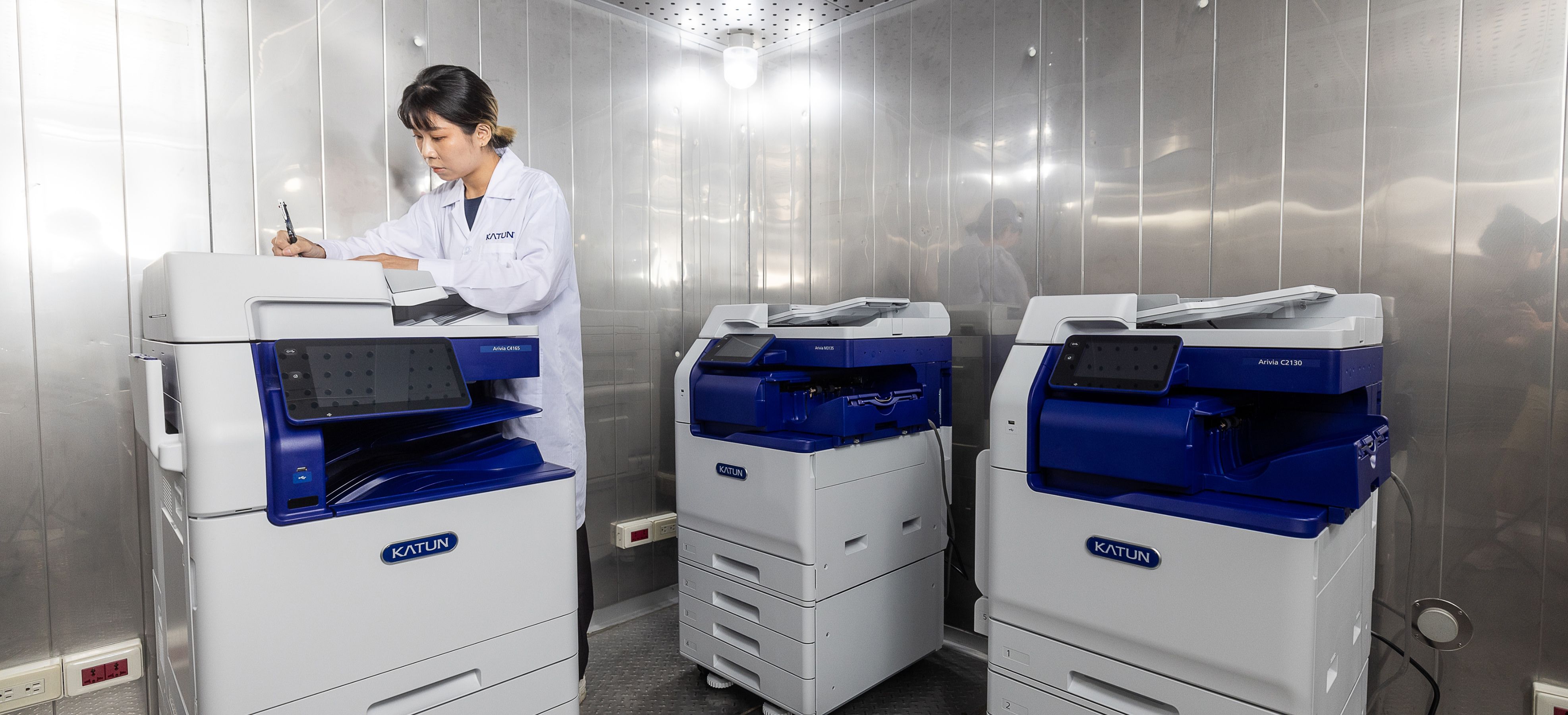 Katun Technician running tests on Arivia MFPs