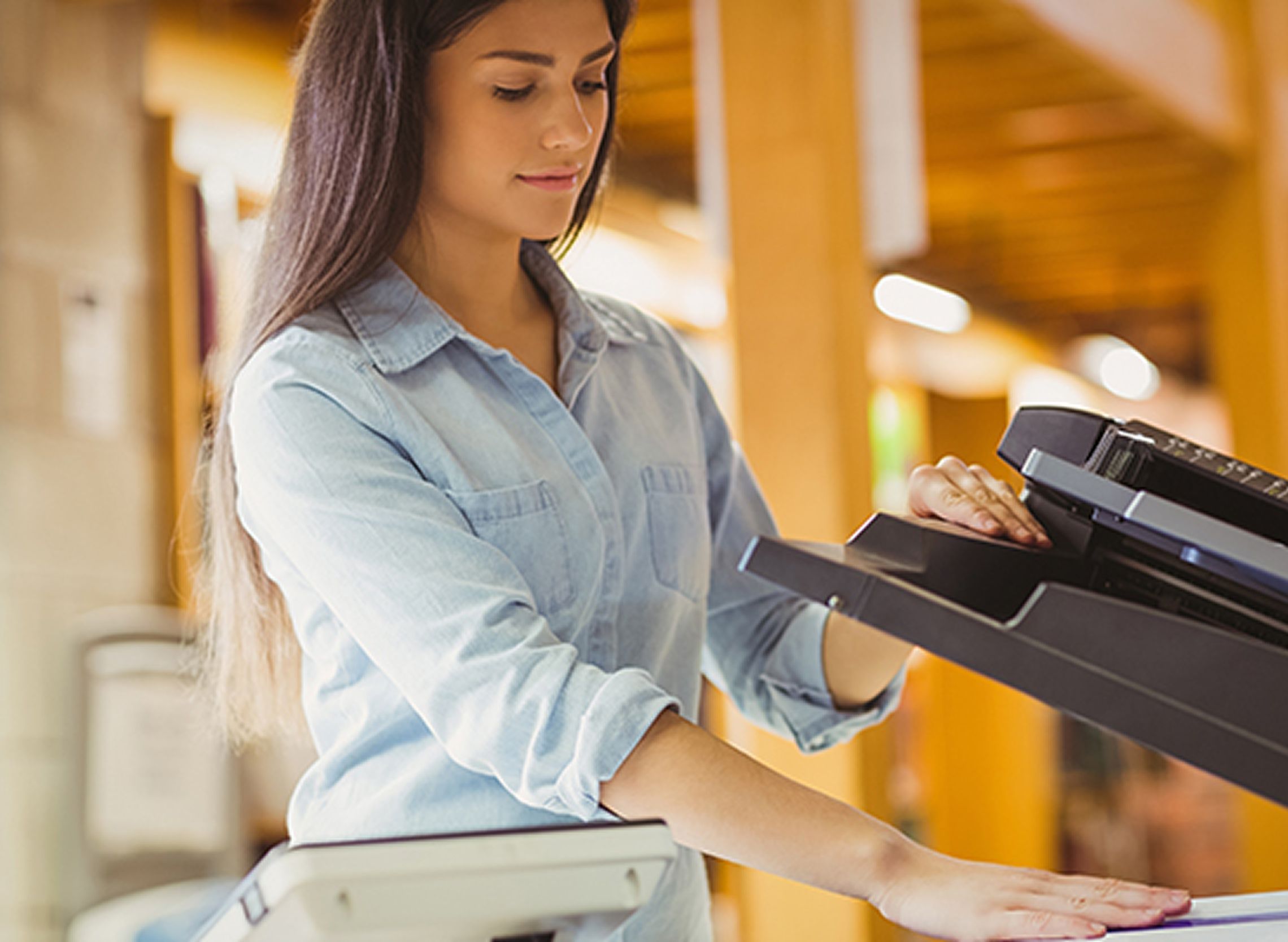 Professional woman making copies in an office